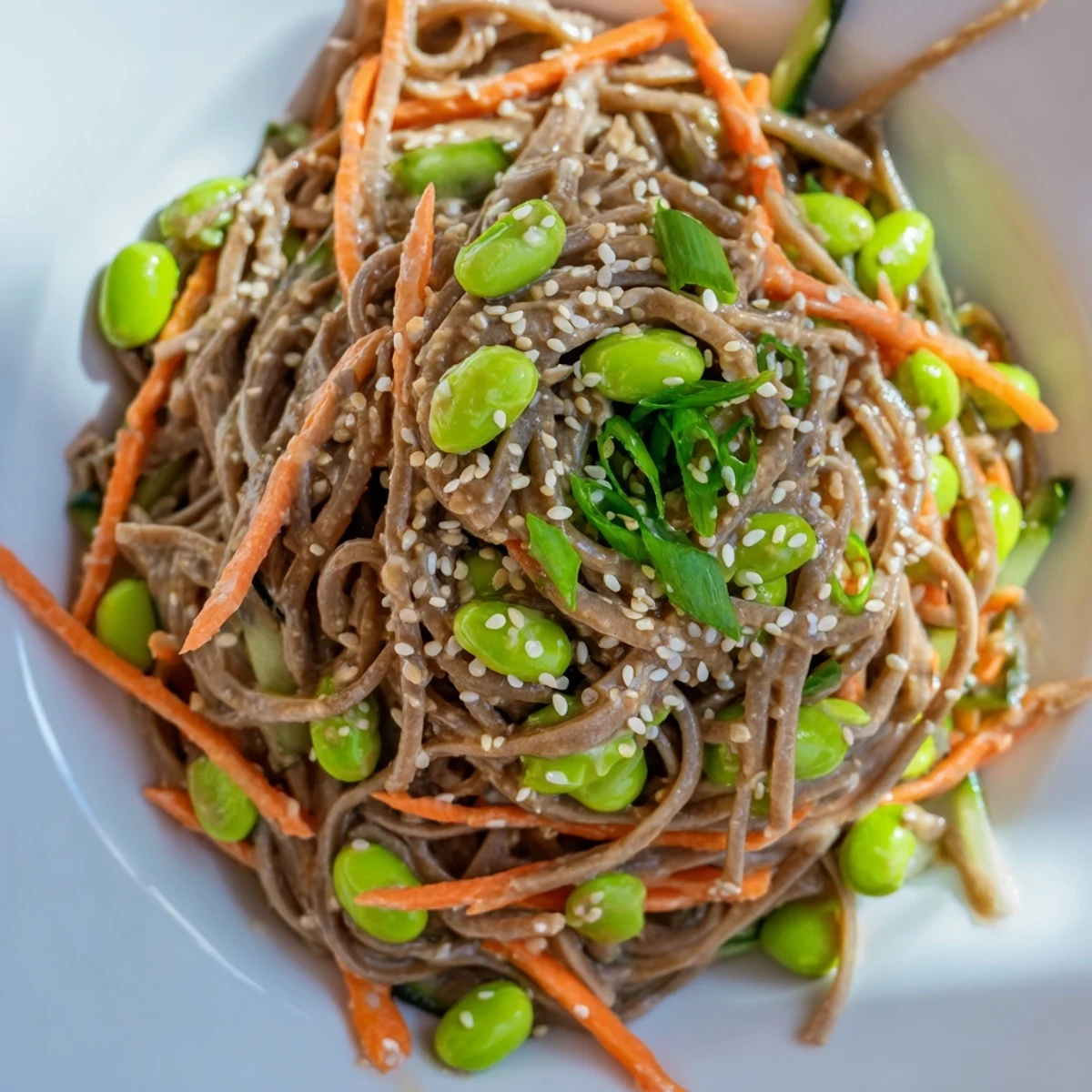 Vibrant Asian sesame noodle salad with fresh vegetables, ready for a delicious, light meal.