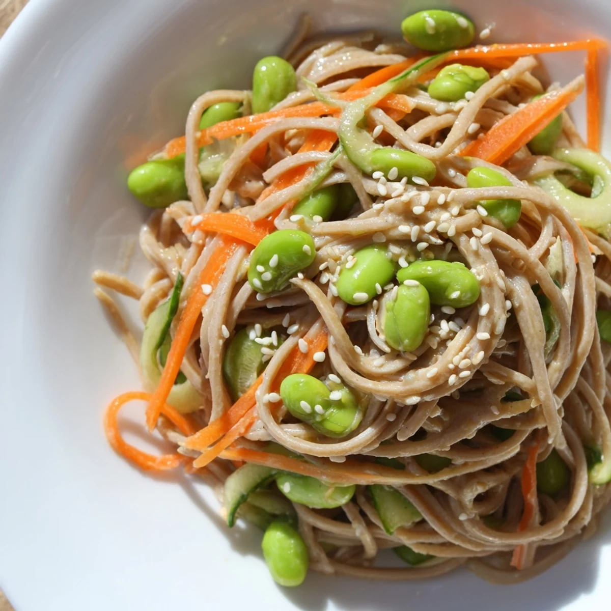 Close-up of a colorful Asian sesame noodle salad, perfect for a refreshing summer lunch.