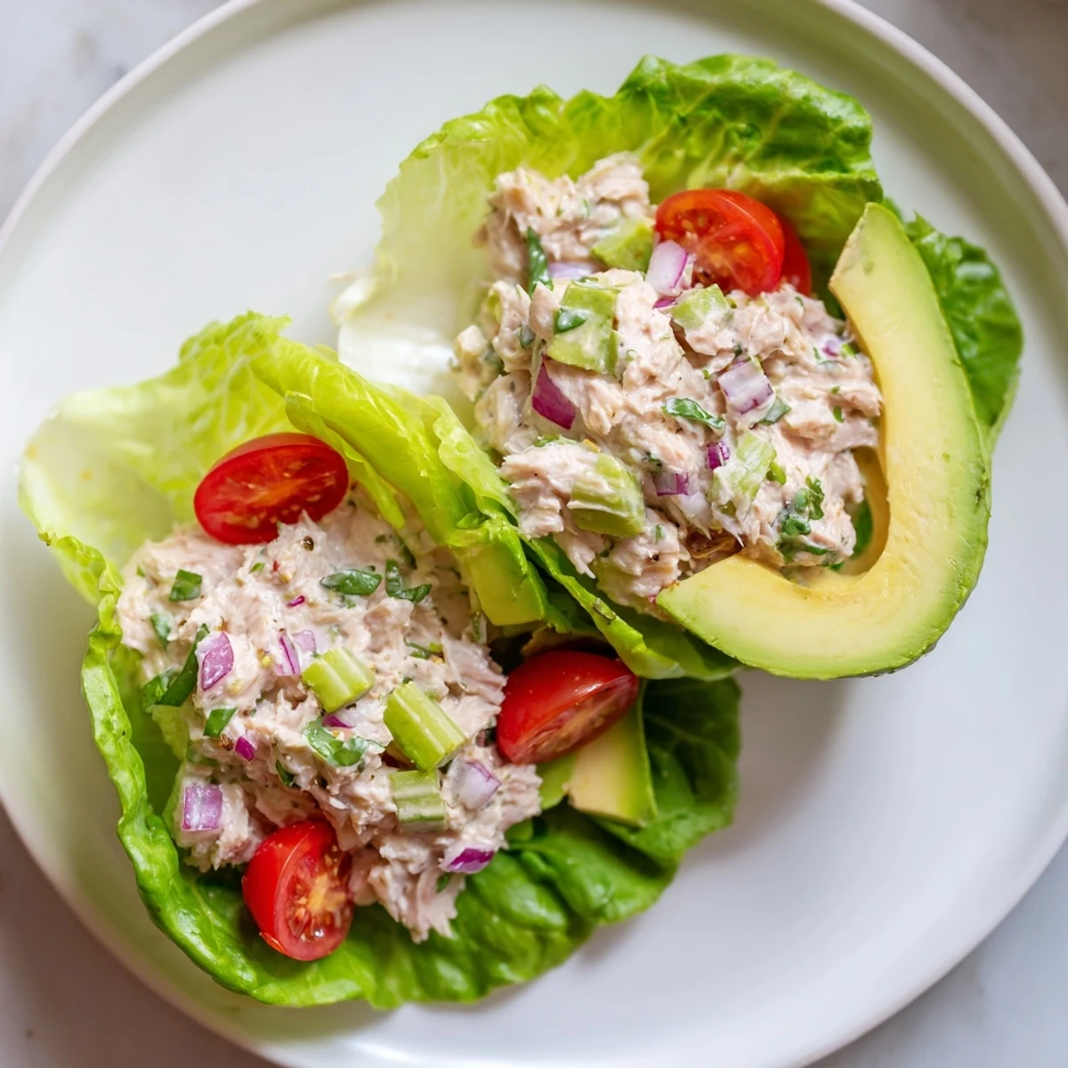 Close-up of Tuna Salad Lettuce Wraps; crisp lettuce holds the flavorful tuna salad.
