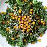 Vibrant warm kale salad with crispy chickpeas: a healthy vegan lunch option, bursting with flavor.