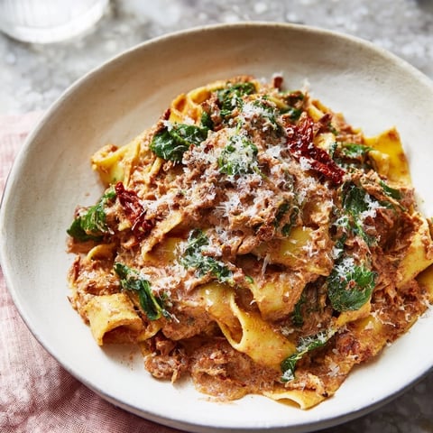 One-Pot Creamy Tuscan Garlic Herb Pasta, a creamy, vibrant dish with fresh basil and Parmesan.