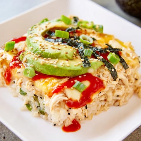 Golden, bubbly Chicken Sushi Bake, a warm casserole with savory chicken and creamy cheese.
