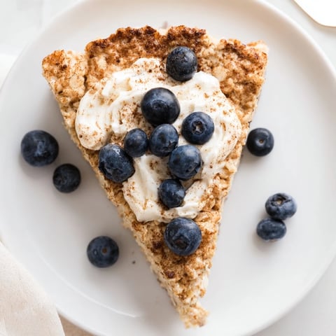 Fluffy Protein Pancake Oats, golden brown from the oven, ready to be sliced and served warm.