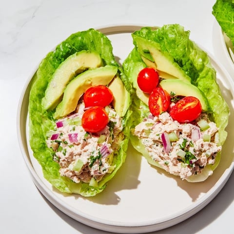 Fresh tuna salad lettuce wraps, filled with creamy tuna, ready for a light, delicious lunch.