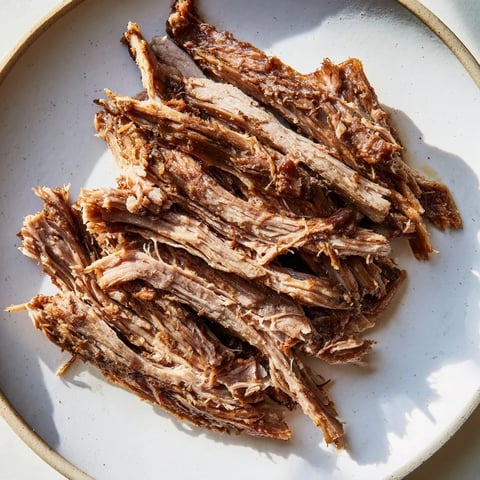 Tender, slow-roasted Omani Shuwa, fragrant with spices, ready to fall apart on your fork.