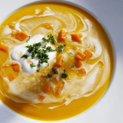 Creamy, smooth texture is showcased in this Sweet Maple Carrot Soup, perfect for Fall.
