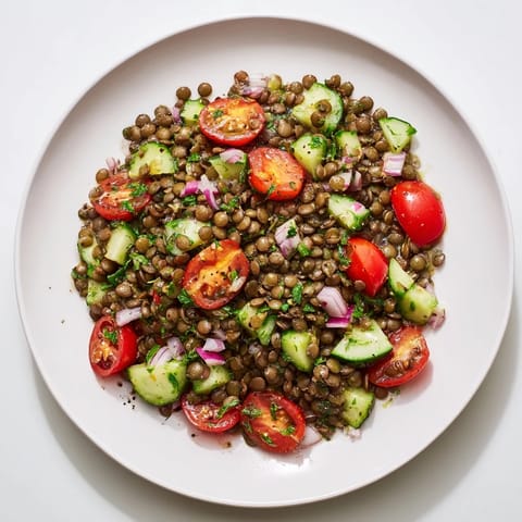 A close-up of a delightful lentil salad, drizzled with vinaigrette, offering a fresh, light lunch.