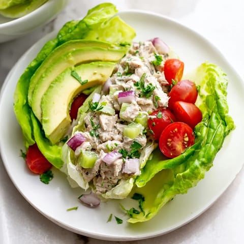 Bright, colorful photo of Tuna Salad Lettuce Wraps with fresh lettuce and vibrant toppings, perfect for summer.