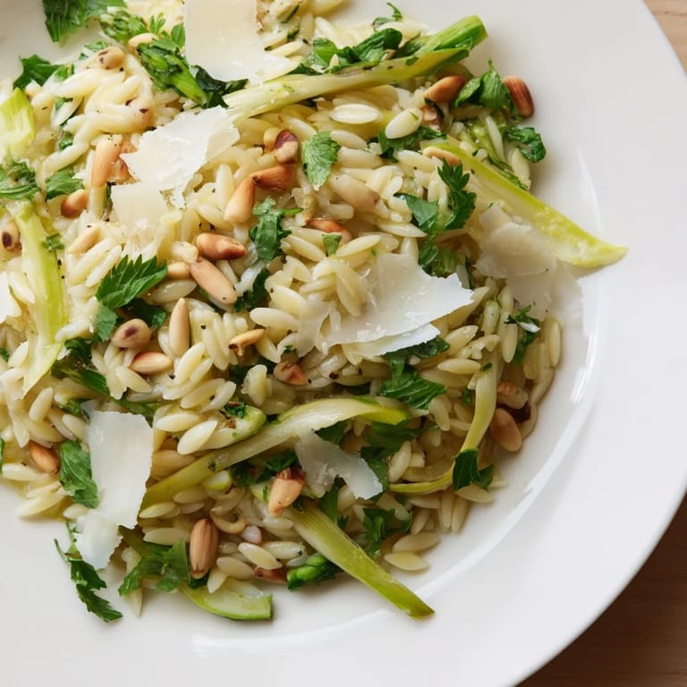 Tossing al dente orzo with crisp shaved asparagus, fresh herbs, and a lemon-olive oil dressing creates a refreshing Mediterranean vegetarian salad.