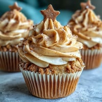 Taurus Birthday Cupcakes with Terracotta Buttercream topped with elegant swirls of warm, earthy frosting and edible gold stars.